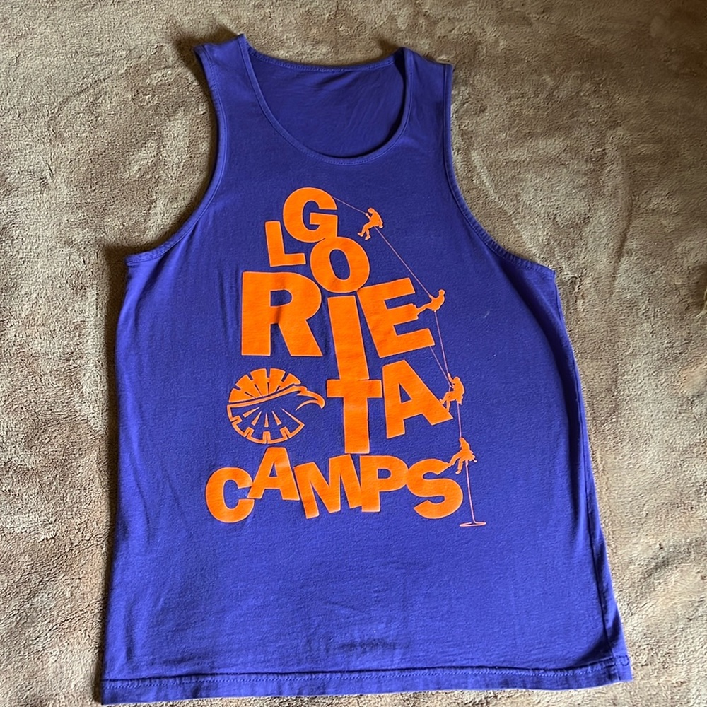 “Glorieta Camps” wording in Front featuring climbing theme. Size Medium.
